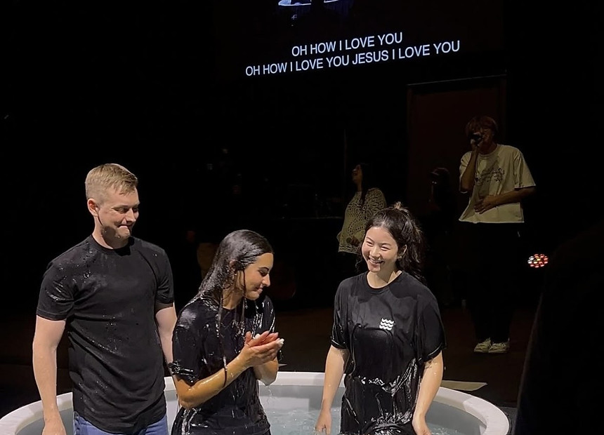 Students worshipping together at an evening gathering