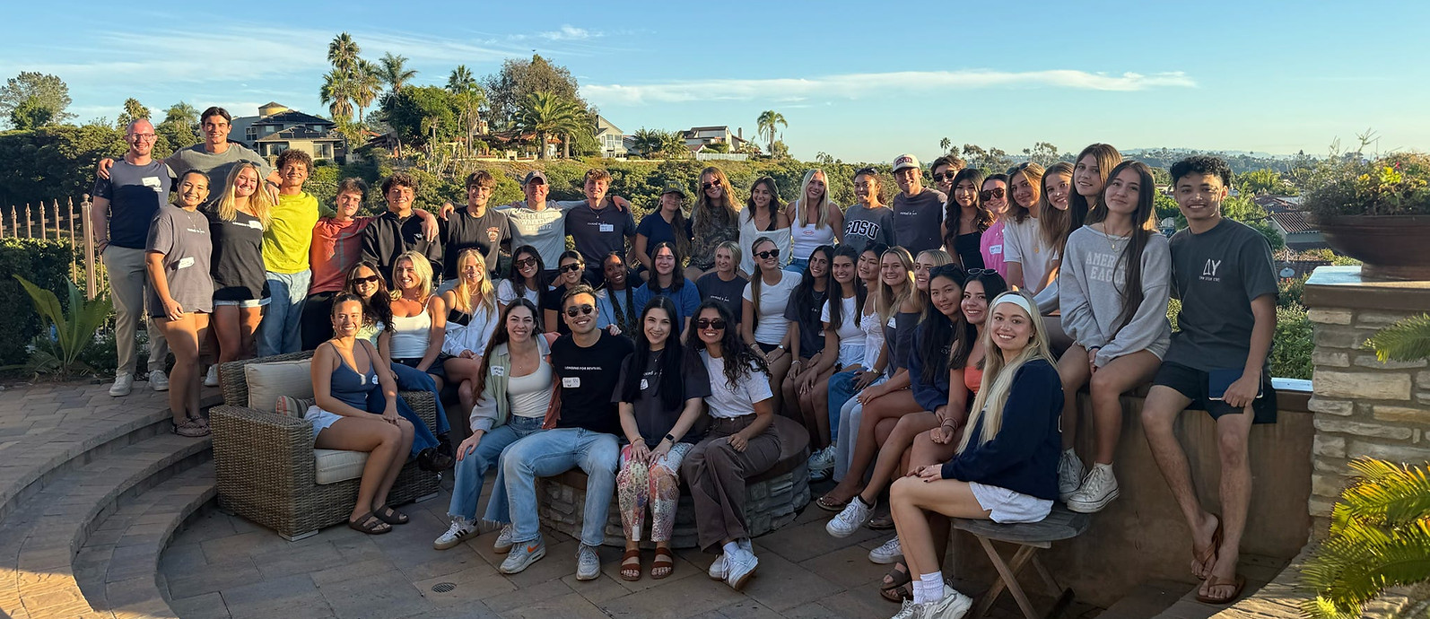 Large group of Greek IV students gathered outdoors
